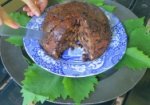 Half eaten Christmas plum pudding.