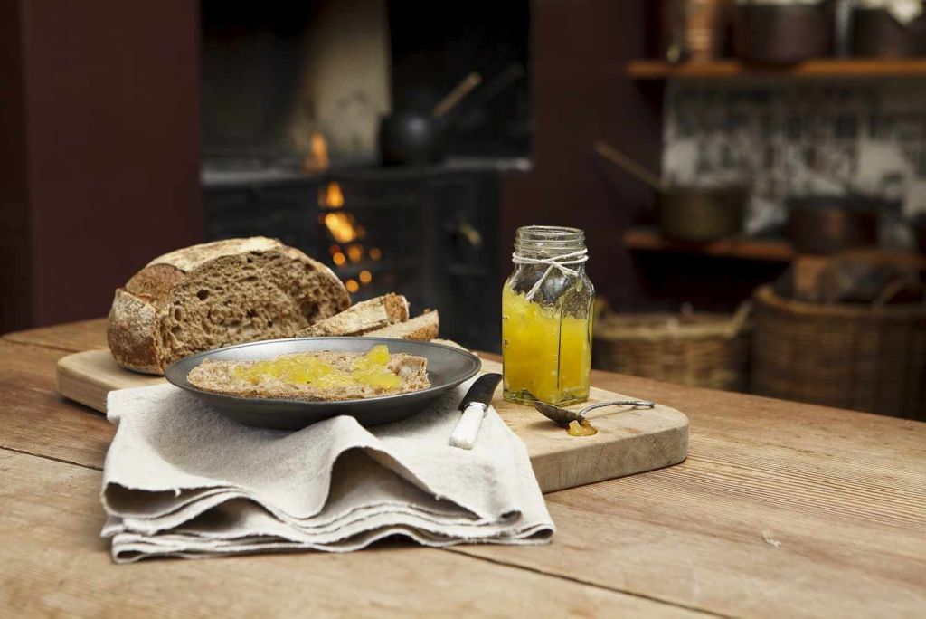 Jam and rustic bread on the kitchen table at Vaucluse House.