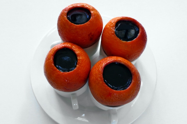 Jelly filled oranges on a plate