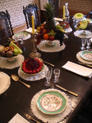 The table set for dessert – with fruits including pineapples, grapes, melons, Cavendish bananas and tamarillos.