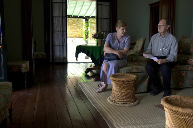 Two visitors sitting in chairs in the drawing room at Elizabeth Farm. 