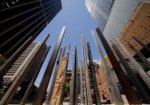 The forecourt at the Museum of Sydney, showing the artwork 'Edge of the Trees' by Janet Laurence, surrounded by the Sydney City CBD