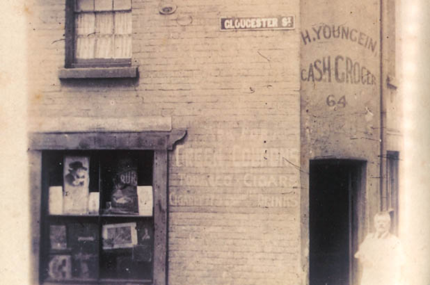 Hugo Youngein poses outside his 'Cash Grocer' corner shop.