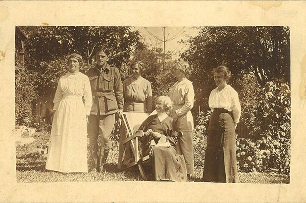 Photograph of Robert 'Bob' Barnet in uniform, with the Thorburn sisters and Elgin Macgregor in the garden at Meroogal, Nowra, 1916.