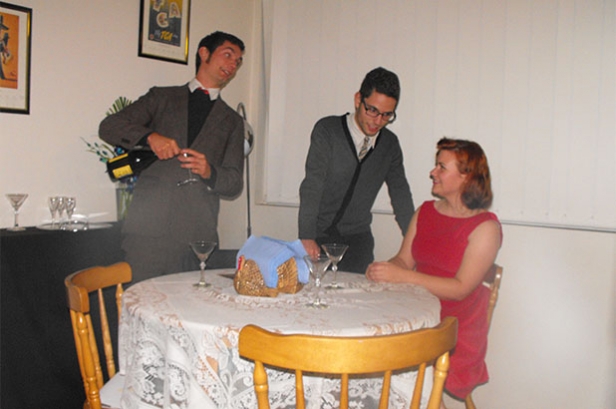 Photograph of a recreation of a Laminex advertisement from Australian Home Beautiful magazine. October 1954. Advertisement depicts a group of friends around a laminate table for a dinner party