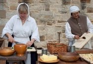 Two women cooking at 'Redcoats and Convicts' at Hyde Park Barracks.