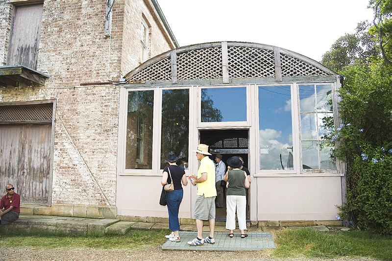 Visitors at the back entry to the arcade at Rouse Hill House